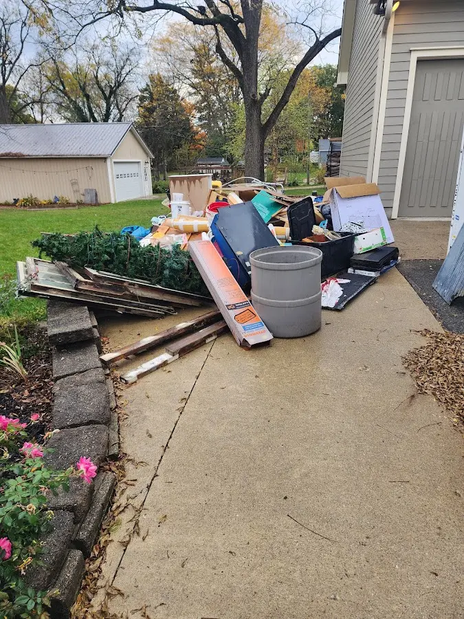 Dumpster being loaded with debris for Residential Dumpster Rental in Maize